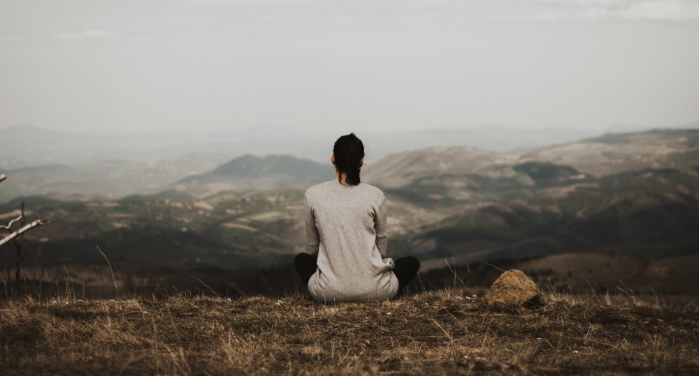 enjoying solitude atop a mountain