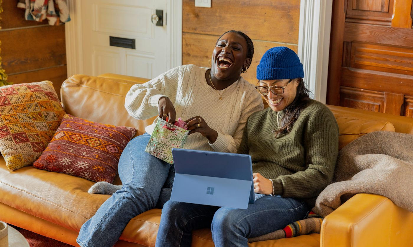 laughing together on the couch