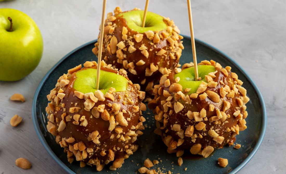 caramel apples with chopped nuts