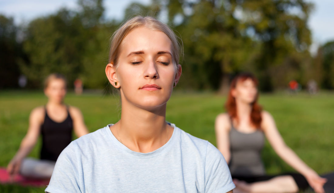 practicing meditation with eyes closed